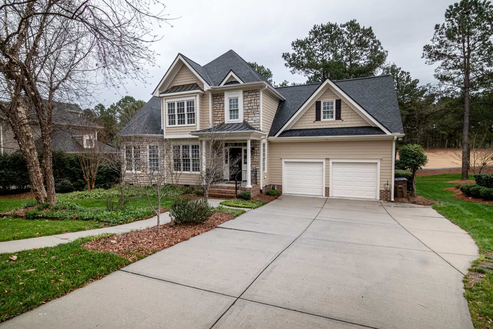 Poured concrete driveway and garage approach at a suburban home